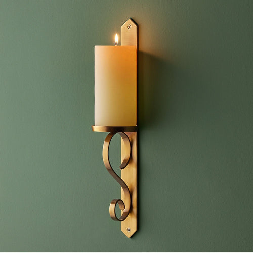 "tivoli wall mounted candle holder in antiqued brass"